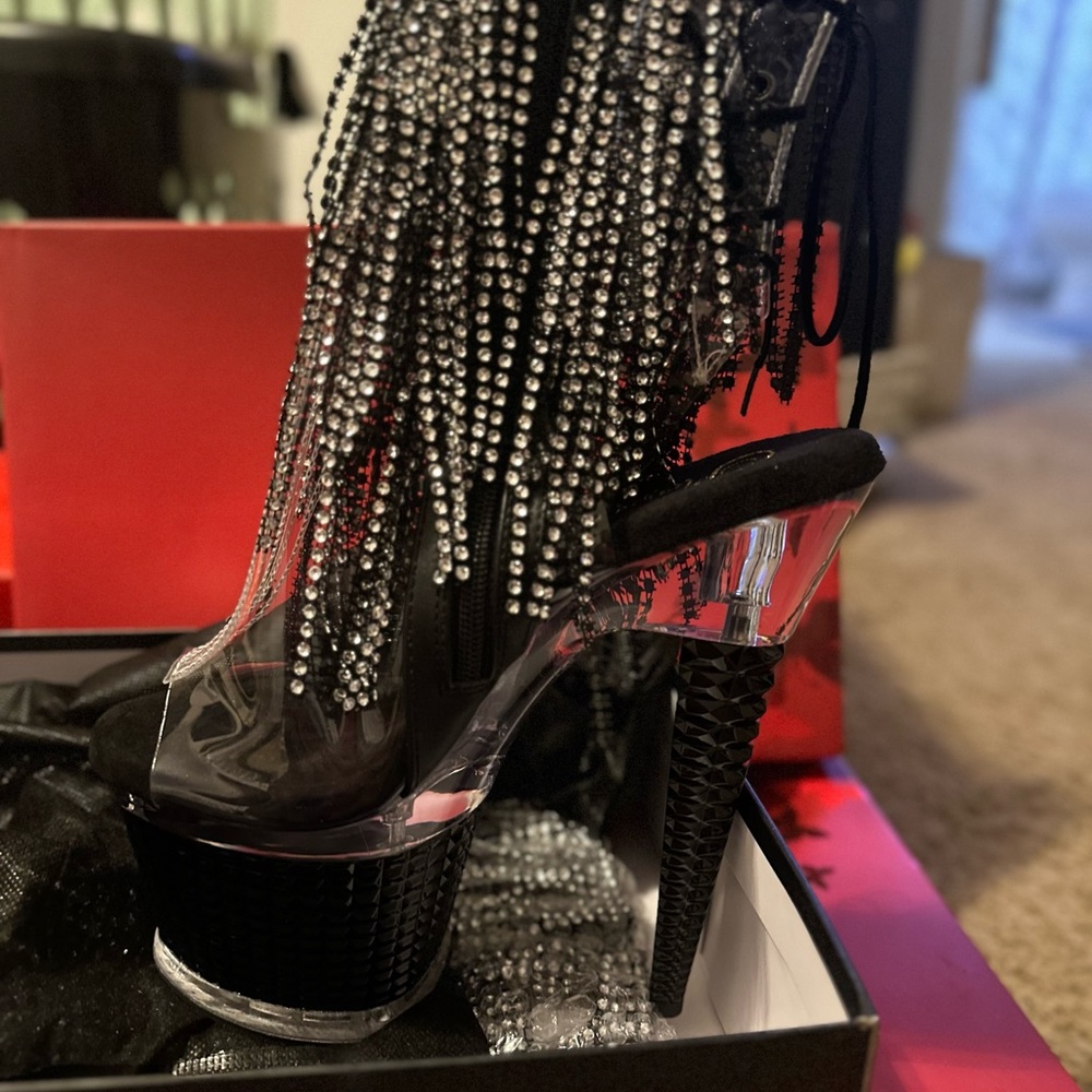 Black stilettos platforms for sale in the area with fringe on them